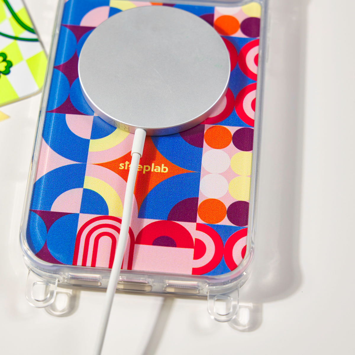 MagSafe charger attached to a Freehand Case