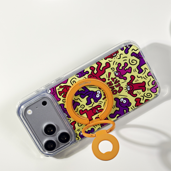 Freehand Loop in Mango opened as a phone stand, showing the three connected rings. Phone and case sold separately.