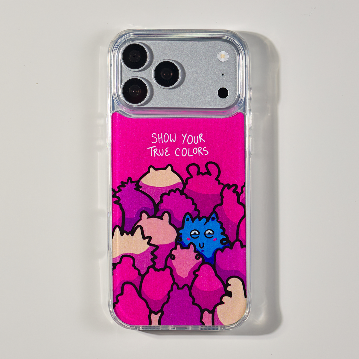 Freehand Case in True Colors for iPhone 18 Pro Max, pink design with colorful illustrated characters, shown from the back on a neutral studio background.