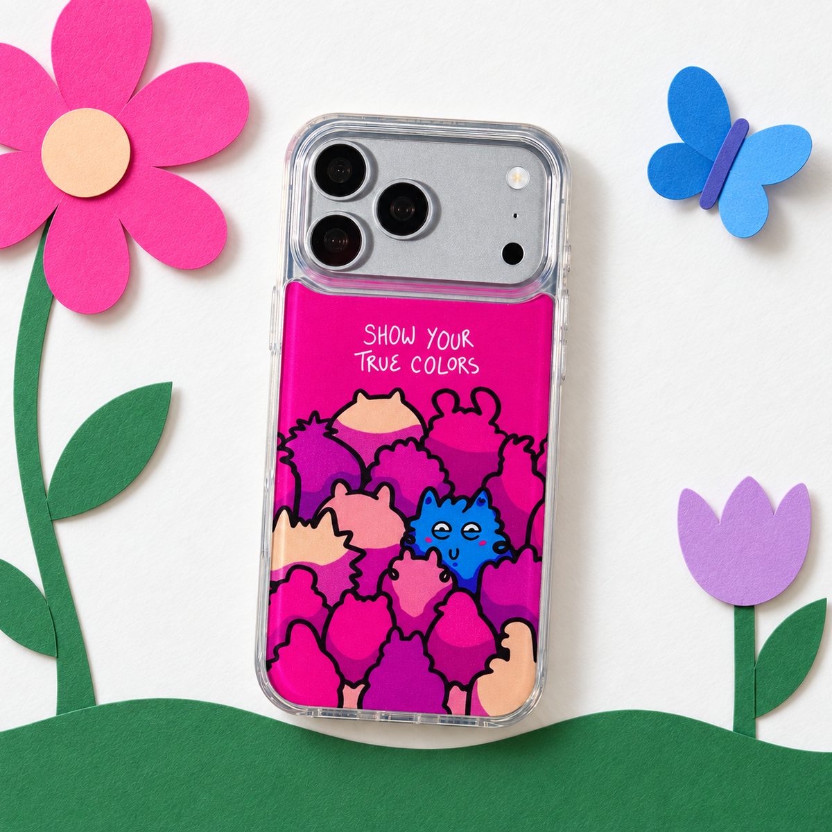 Freehand Case in True Colors for iPhone 18 Pro Max, pink design with colorful illustrated characters, in a playful colored-paper scene.